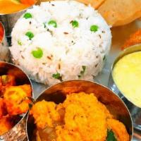Royal Thali · 8Oz:  1 Veg Curry | 1 Dal | 1 Dry Sabzi | 1 Rice of the day | 
3 Chapati | 1 Sweet.