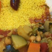 Couscous (v) · Vegan. Vegetable stew with zucchini, carrot, tomato, yellow squash, onion, bell pepper, garb...