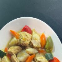 CHICKEN CURRY OVER RICE · Chicken thigh in a semi-spicy yellow curry sauce with potato, carrot, bell pepper, squash, z...