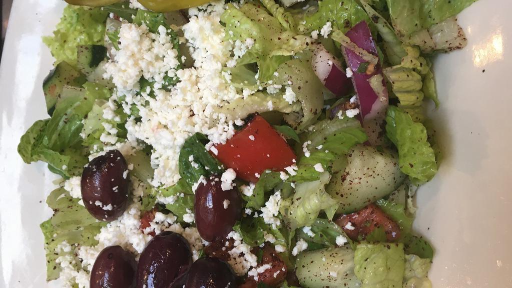 Fattoush Salad · Romaine, tomato, sheep feta, sumac, cucumber, onion, mint, pita croutons, olives, lemon-garlic-olive oil dressing.