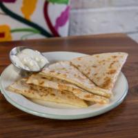 Kids Quesadilla · Flour quesadilla served with a side of sour cream