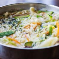 Korean Noodle Soup · Thick flour noodle soup with vegetables and egg.