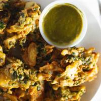 Vegetable Pakoras · Assortment of vegetables marinated in gram flour and spice to perfection. Fresh chopped onio...