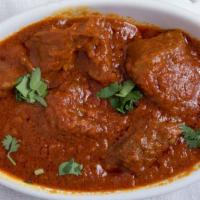 Lamb Curry · Exotic blend of boneless lamb cooked with ginger, garlic, and herbs.