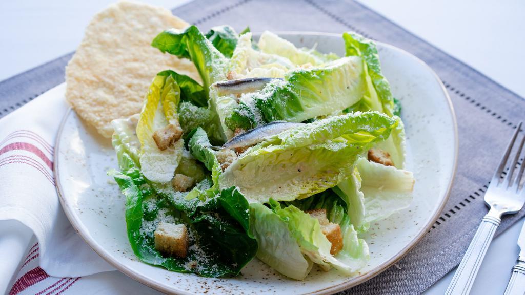 Little Gem Caesar · 440 cal. little gem lettuce, garlic croutons, parmesan cheese crisp, white anchovy, caesar dressing with roasted chicken/ with wild salmon for an extra charge