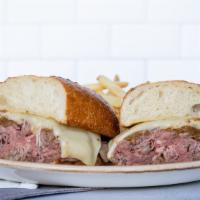 *Prime French Dip · 1410/1050 cal. warm roast beef, sharp white cheddar cheese, toasted parmesan baguette, au ju...