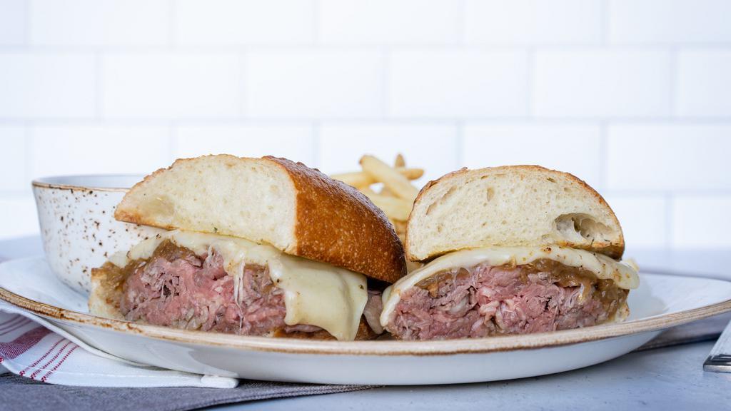 Prime French Dip · 1410/1050 cal. warm roast beef, sharp white cheddar cheese, toasted parmesan baguette, au jus, Salt & Pepper crush french fries and kalamata aioli or side salad