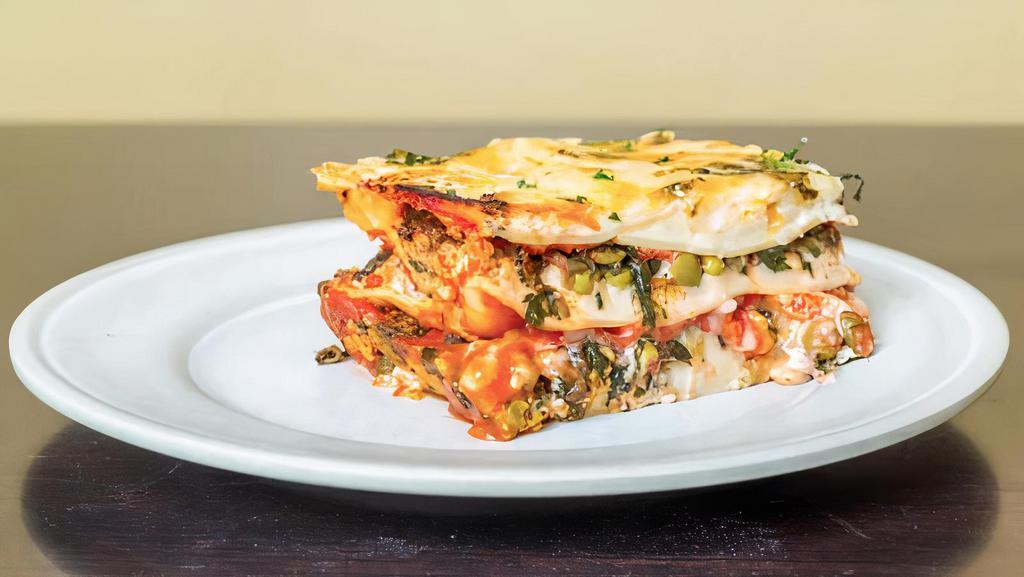 All Green Lasagna · Premium baby spinach leaves, green beans and steamed peas, plus Italian style marinara sauce, cashew cream, and high-quality vegan cheese.