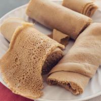 Injera (INJ) · Delicious bread made with teff flour and barley which have small traces of Glutten, it doesn...