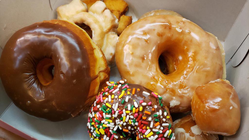 HALF DOZEN DONUTS · Mixed variety of raise, old fashion cake, French cruller and cake. Exclude specialties and fancy donuts. 
Selection may not available after 9AM.