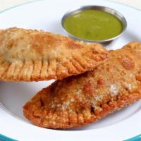 Picadillo Empanadas · spiced ground beef and famous green sauce.