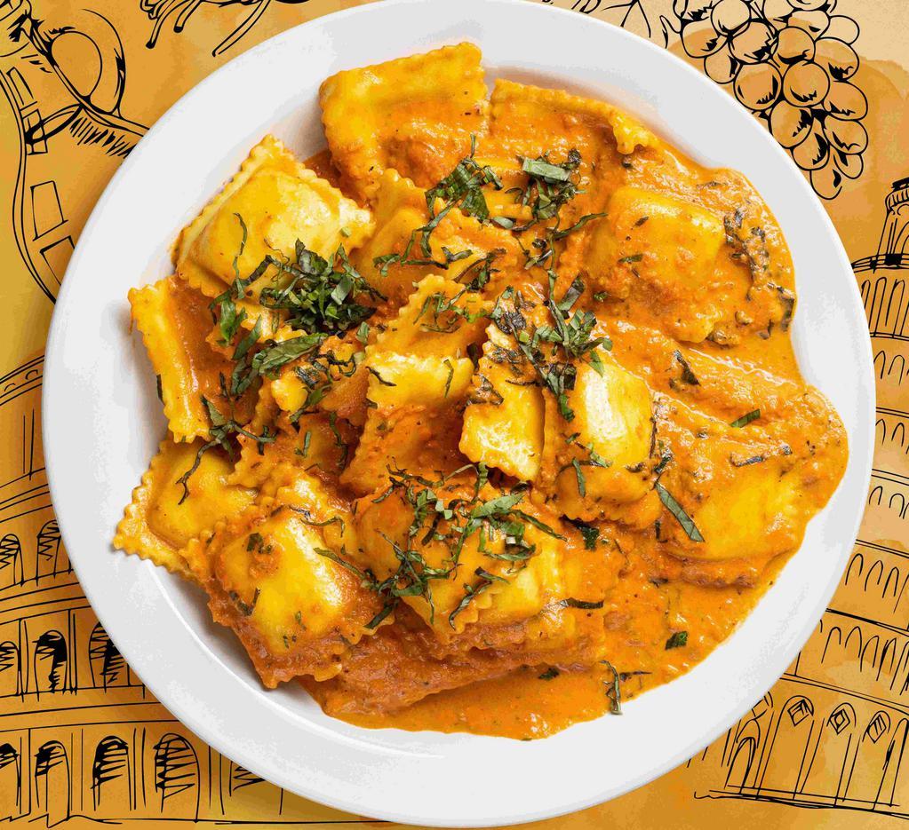 I Ravi-Only Have Eyes For You · Our amazing cheese ravioli in a tomato and cream sauce blend with fresh spinach and herbs.