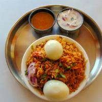 Egg Biryani · Basmati rice cooked in dum with two eggs.