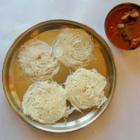 Idiyappam with Mutton Curry (4 Pc) · Steamed rice strings served with mutton curry.