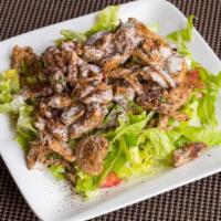 Chicken Shawarma salad · mixed green salad topped with thinly sliced of chicken