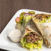 Beef Shawarma · wrap sandwich with thin slices of beef, tomatoes, cucumber, lettuce served with house sauce