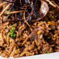 Mujaddara · Served with lentils, rice, and house seasoning topped with fried onions and comes with yogur...