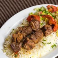 Lamb Kabab  · Marinated and charbroiled cubes of lamb. Served with two sides: choice of rice or salad or h...