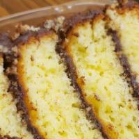 Slice Yellow Chocolate Cake · Yellow chocolate cake made with eggs, flour, sugar, fudge.
