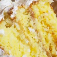 Slice Cocont Pineapple Cake · Made with eggs, flour, sugar, pineapple, coconut.