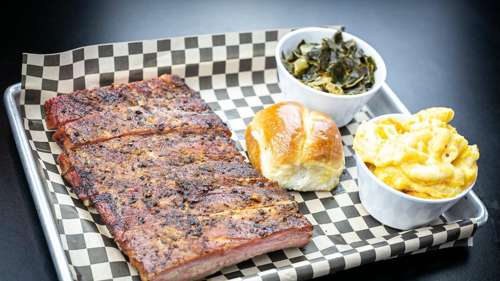 Half Slab · 6 bones of our signature pork ribs.
Served with two sides (Honey Butter roll optinal)