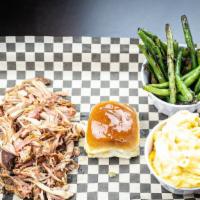 Pulled Pork Plate · 1/2 pound of our 6hr smoked pork butt.
Served with two sides, (Honey Butter roll optinal)