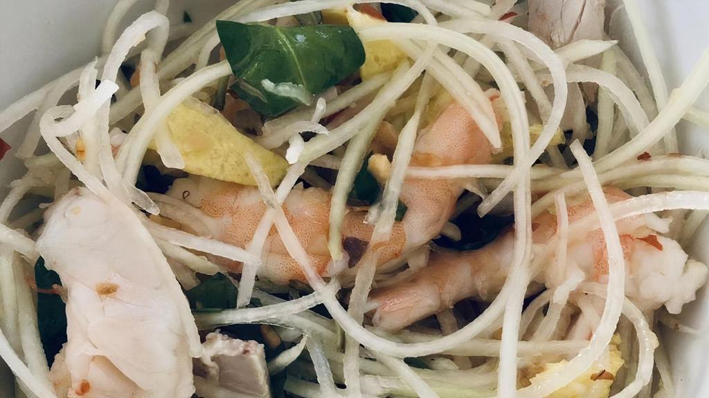 06. Papaya Salad · With shrimp and pork.