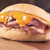 Bacon Cheddar Buck Tri Tip Sandwich · Bacon, cheddar cheese, & Red Ranch sauce.