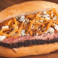 Roadhouse Buck Tri Tip Sandwich · Roadhouse Onions, bleu cheese, & Red Ranch sauce.