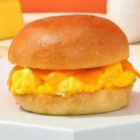 Scrambled Egg And Cheese · Scrambled eggs and melted cheddar cheese on your choice of bread.