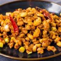 Kung Pao Chicken · A spicy stir-fry of chicken, scallions, peanuts, and red chilies.