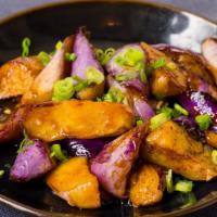 Garlic Eggplant · Vegetarian. Gently stir fried in a sweet, slightly spicy, chili, and garlic sauce, garnished...