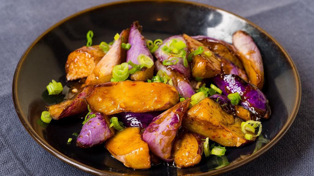 Garlic Eggplant · Vegetarian. Gently stir fried in a sweet, slightly spicy, chili, and garlic sauce, garnished with scallions.