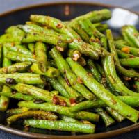 Sichuan Green Beans · Vegetarian. Dry-braised in a spicy, ginger, garlic, brown bean, and chili sauce.
