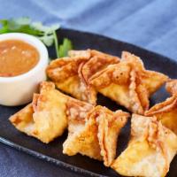 Crab Wontons
 · Fresh dungeness crab, cream cheese, and scallions, fried crispy, and served with a plum dipp...