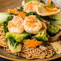 Hong Kong Noodles · Prawns, flank steak, chicken, bok choy, carrots, broccoli, scallions, and mushrooms over a c...