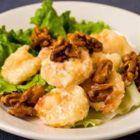 Walnut Prawns · Lightly battered and tossed in a sweet sauce, served with candied walnuts.