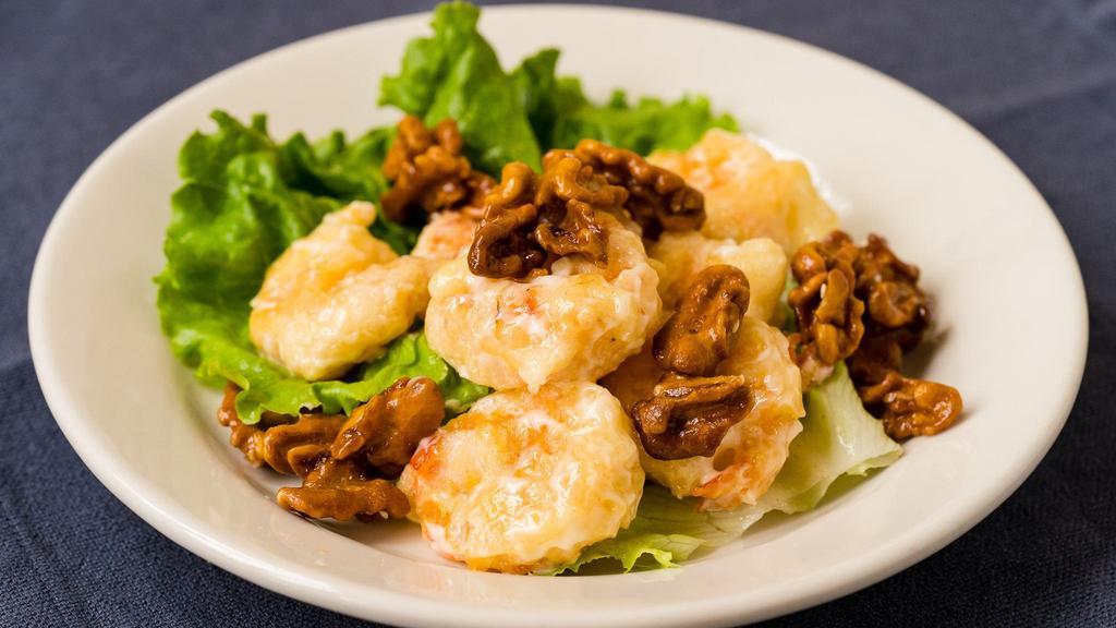 Walnut Prawns · Lightly battered and tossed in a sweet sauce, served with candied walnuts.