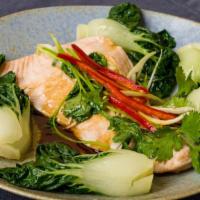 Steamed Salmon with Ginger & Soy · Fresh scottish salmon accented with soy, hot sesame oil, and rice wine, garnished with bok c...