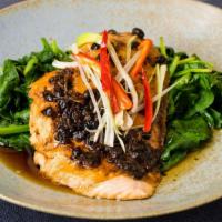 Steamed Black Bean Salmon · Salmon filet steamed in a light sauce of black beans, soy and rice wine; garnished with spin...