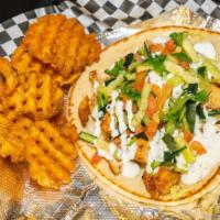 Gyro Wrap · Lamb or beef served with lettuce, veggies, tzatziki, and chutney sauce on pita bread.
Spicy/...