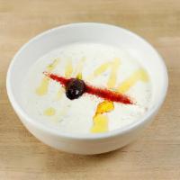 Tzatziki · Vegetarian. Plain yogurt with diced cucumber, oregano, parsley & hint of garlic.