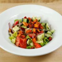 Fattoush Salad · Vegetarian. Romaine hearts, tomatoes, cucumbers, bell peppers, sumac, dry mint, pitta chips,...