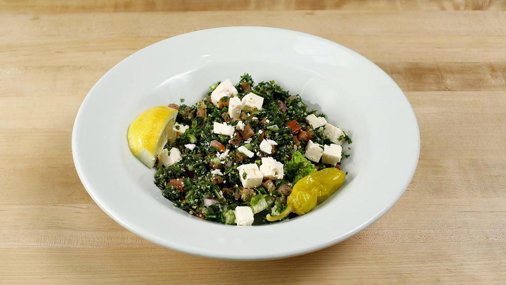 Tabbouleh Salad · Vegetarian. Cracked wheat, tomato, bell peppers, red onion, parsley, lemon juice, olive oil dressing