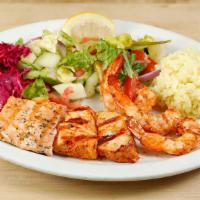 Seafood Combo Plate · Grilled swordfish, salmon & prawns, marinated with olive oil, lemon & herbs.