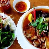 1. Spicy Beef & Pork With Thick Rice Noodle Soup - Bun Bo Hue · Our traditional bowl of soup from our hometown in Hue City.  The soup comes with beef, pork,...