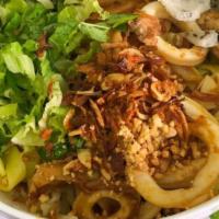 14. Flat Yellow Egg Noodle - Mi Quang · With pork, shrimp, and squid.