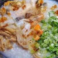 124. Seafood Porridge - Chao hai san · With shrimp, squid, and fish ball.