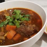 78. Beef Stew- Com bo kho · Served over rice.