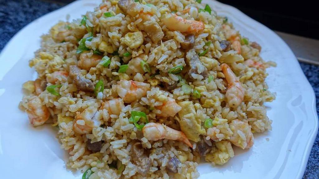 69. Combination Fried Rice - Com chien thap cam · With chicken, shrimp, and squid.